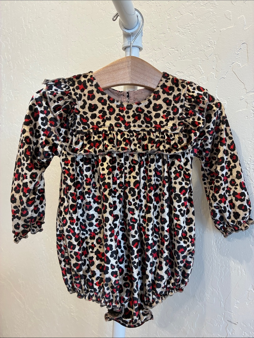 Pink Chicken Leopard Print Long Sleeve One-Piece in Cream, Black, Red